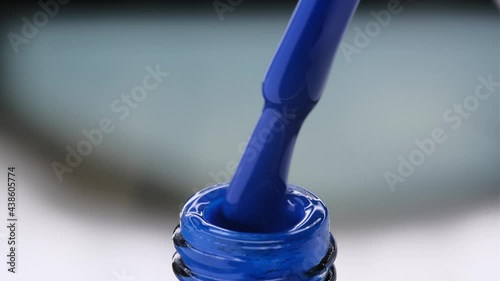 gel paint for nails of blue color. drawing liquid
