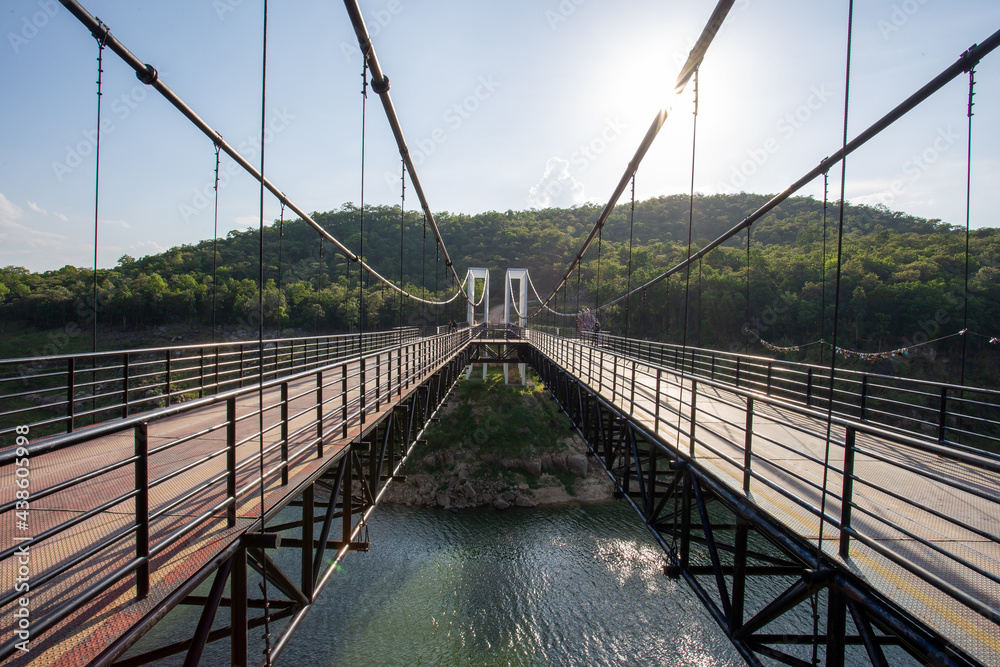 Obraz premium large suspension bridge The car can drive through it. bridge over the river Reservoirs in Thailand look grand and beautiful.