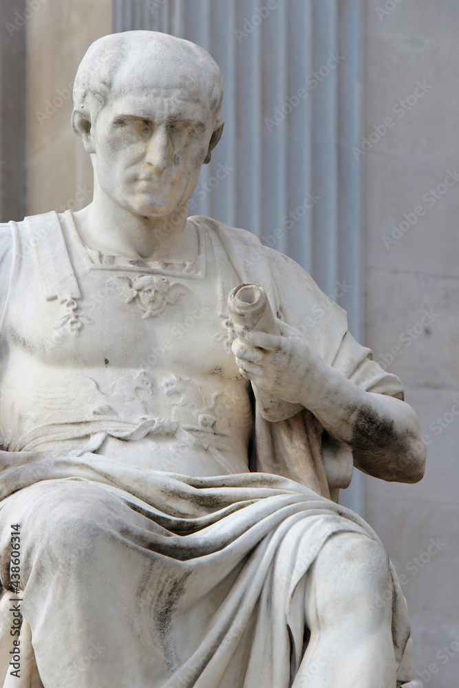 statue of a roman emperor in front the austrian parliament in vienna (austria)