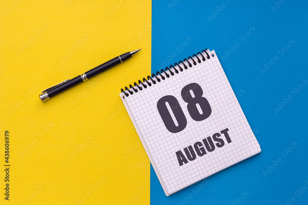 August 8th. Day of 8 month, calendar date. A notebook with a spiral and a pen lies on a yellow-blue background, flat lay, copy space August 8th. Day of 8 month, calendar date. A notebook with a spiral and a pen lies on a yellow-blue background, flat lay, copy space