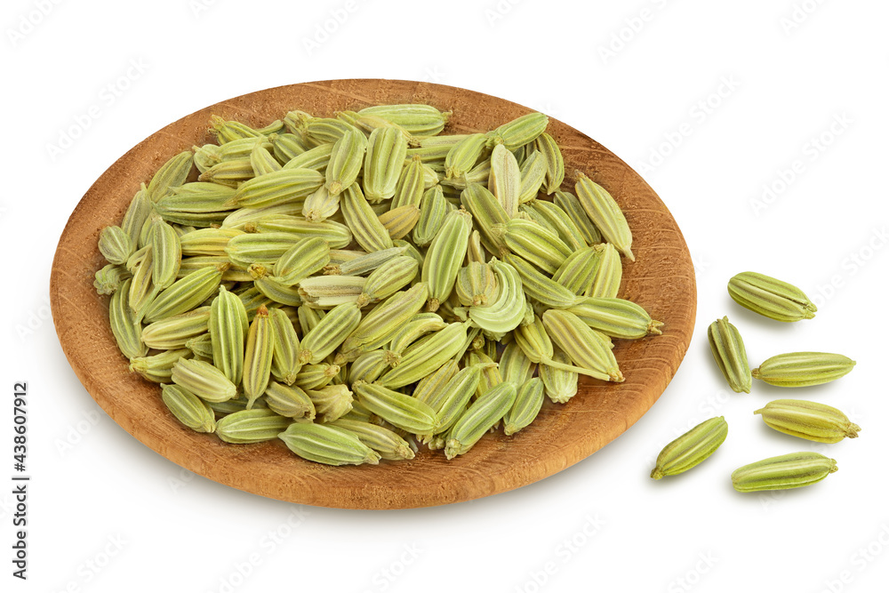 Dried fennel seeds in wooden bowl isolated on white background with clipping path and full depth of field Dried fennel seeds in wooden bowl isolated on white background with clipping path and full depth of field