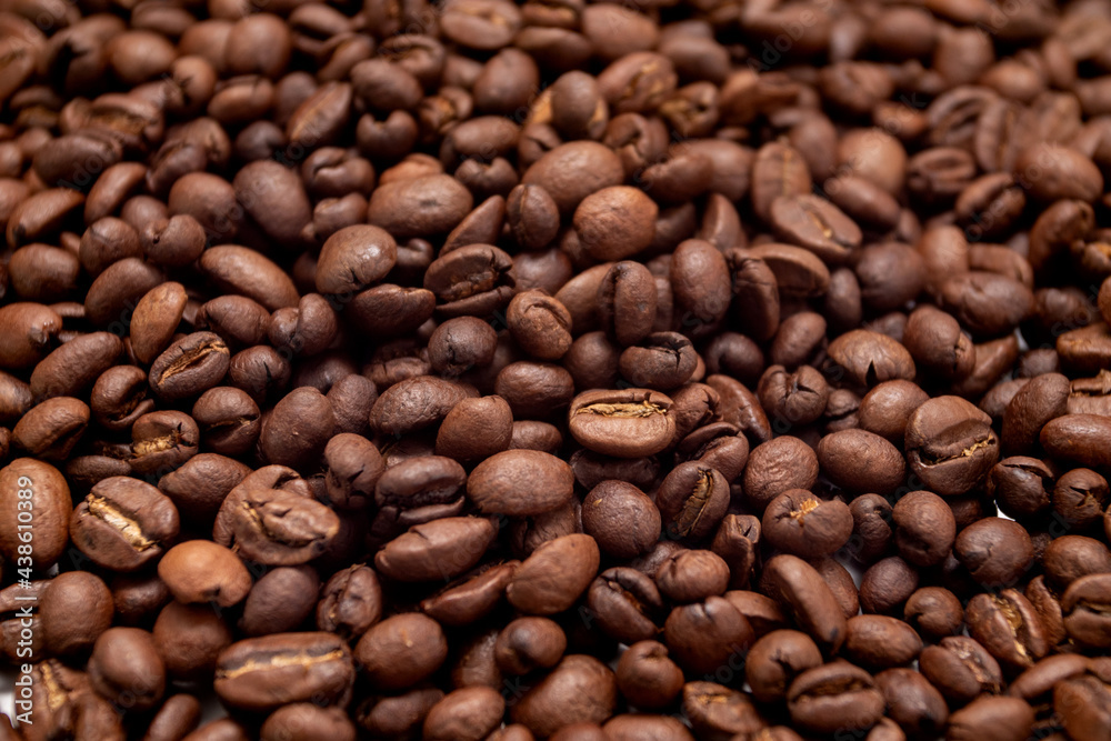 Coffee beans background. Roasted coffee full frame. Texture of dark coffee beans. Coffee beans background. Roasted coffee full frame. Texture of dark coffee beans.
