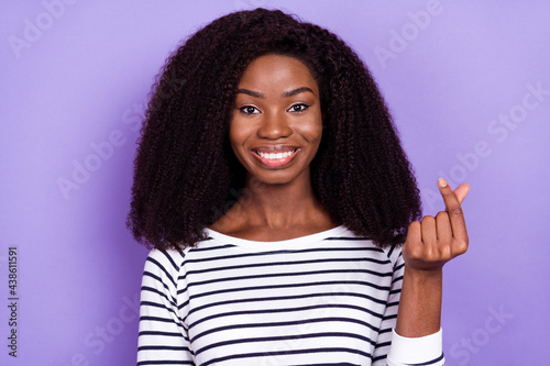 Photo of sweet young lady show like sign wear striped sweater isolated on violet color background © deagreez