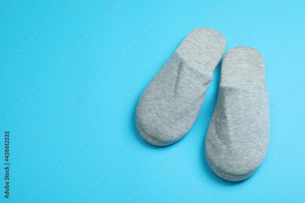 Pair of house slippers on blue background Pair of house slippers on blue background