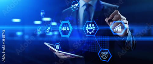 M&A Merger and acquisition business finance concept. Businessman pressing button. photo