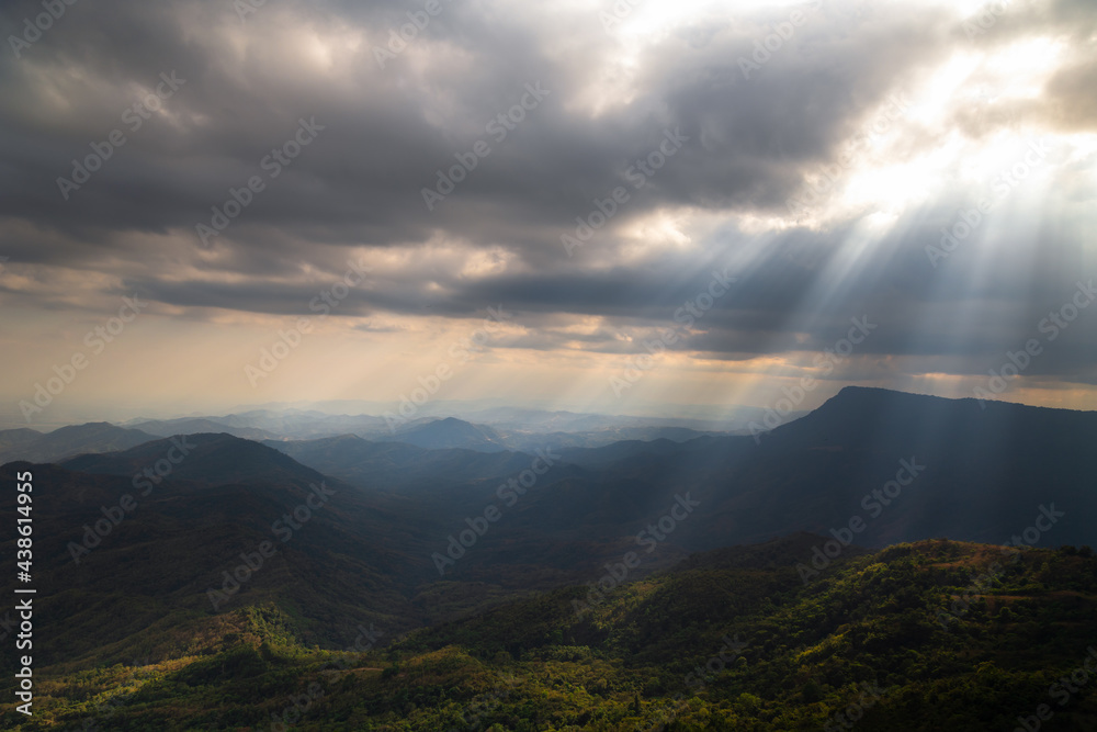 Beautiful landscape of layer mountain with cloudy and sunbeam. Hills with sunray. rain forest and environment with sun light.