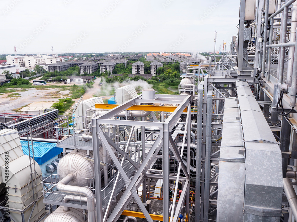 Heat recovery steam generator and sky in Combined-Cycle Co-Generation Power Plant which it so beautiful and popular to background power plant concept. Heat recovery steam generator and sky in Combined-Cycle Co-Generation Power Plant which it so beautiful and popular to background power plant concept.
