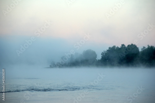 Fog on the river early in the morning during the summer