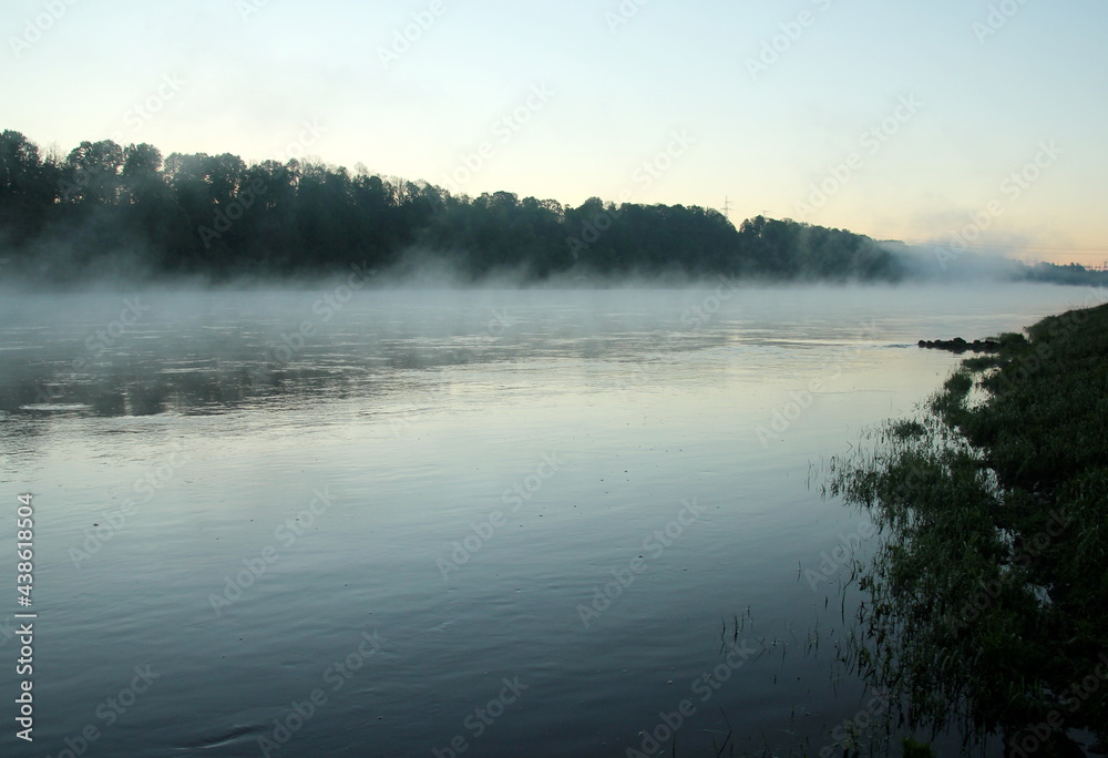 Fototapeta premium Fog on the river early in the morning during the summer