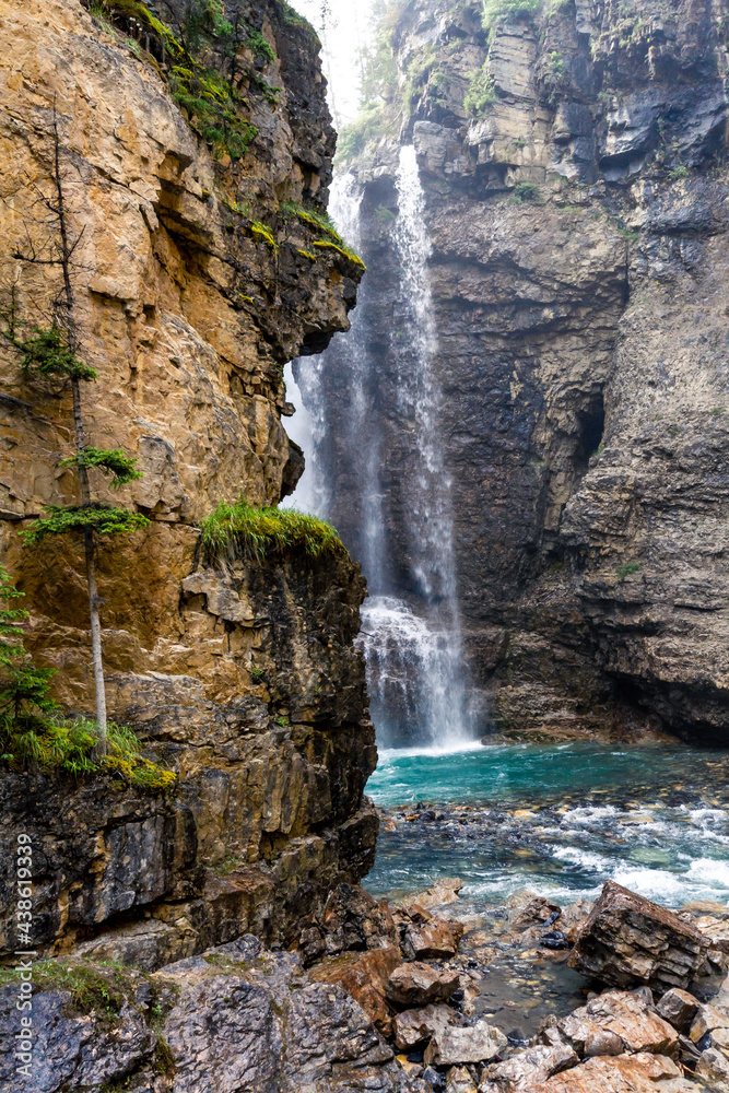 Hiking trail in the  Rocky Mountains. Waterfall in the Johnston Canyon. Banff National Park, Alberta, Canada