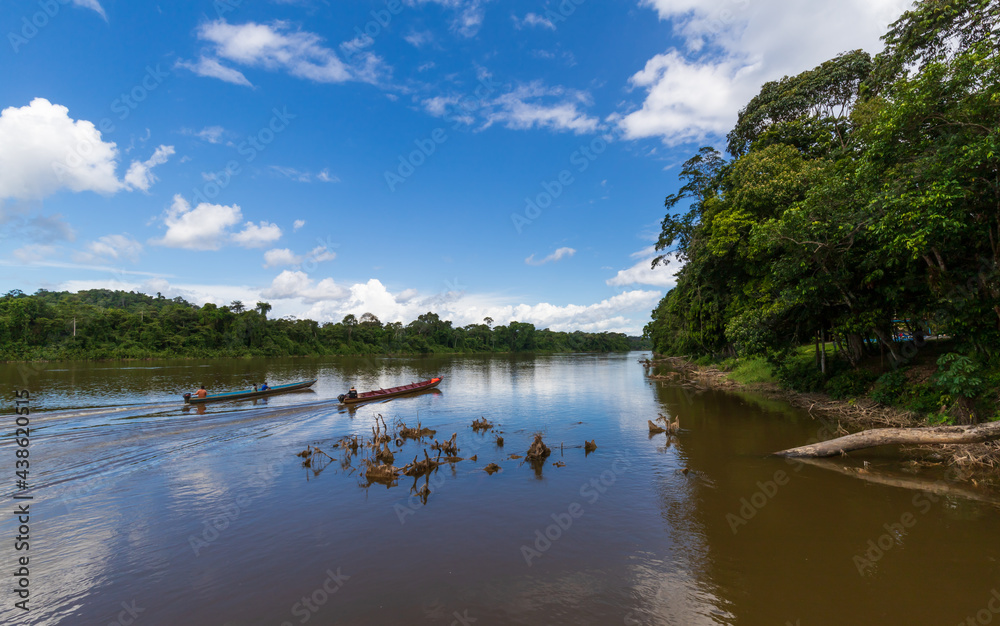 Boats Sailing Down A Long River In Suriname Boats Sailing Down A Long River In Suriname