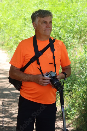 Man Photographer on a Forest Trail Taking Photography Pictures