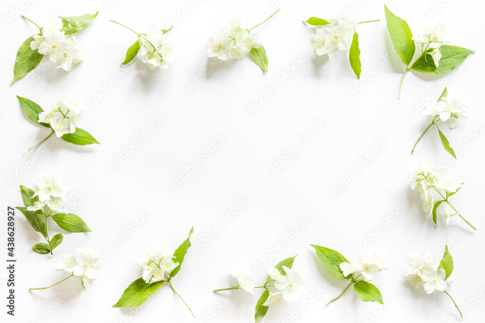 Fototapeta premium Frame of white jasmine flowers. Top view flat lay