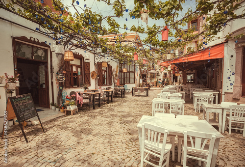 Obraz na plátně Sunny cafe with terrace with tables and without people on touristic area of  Tur