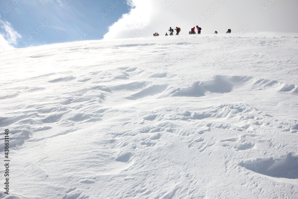 Group of mountaineers walking trough the mountains covered with snow... Group of mountaineers walking trough the mountains covered with snow...
