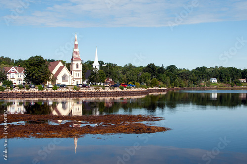 Picturesque church reflecting in waters on maritime coast