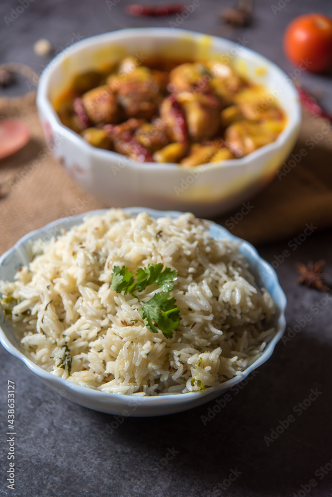 Kadhi chawal an Indian delicacy prepared with rice by putting fried fritters in yogurt based curry. Close up Kadhi chawal an Indian delicacy prepared with rice by putting fried fritters in yogurt based curry. Close up