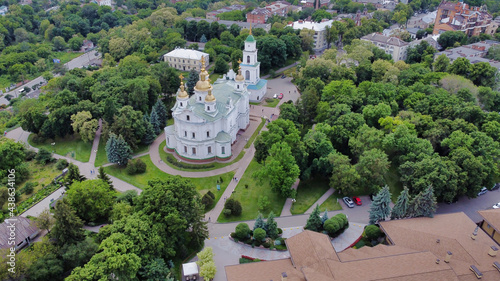 Poltava: Assumption cathedral. Houses in Historic center and green trees. Ukraine. Europe photo