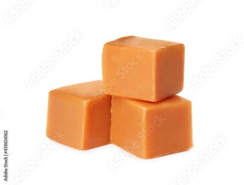 Three caramel cubes on white background. Confectionery
