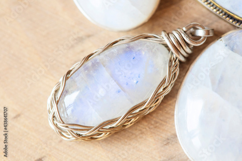 Mineral moon stone sterling silver simple pendant on neutral background