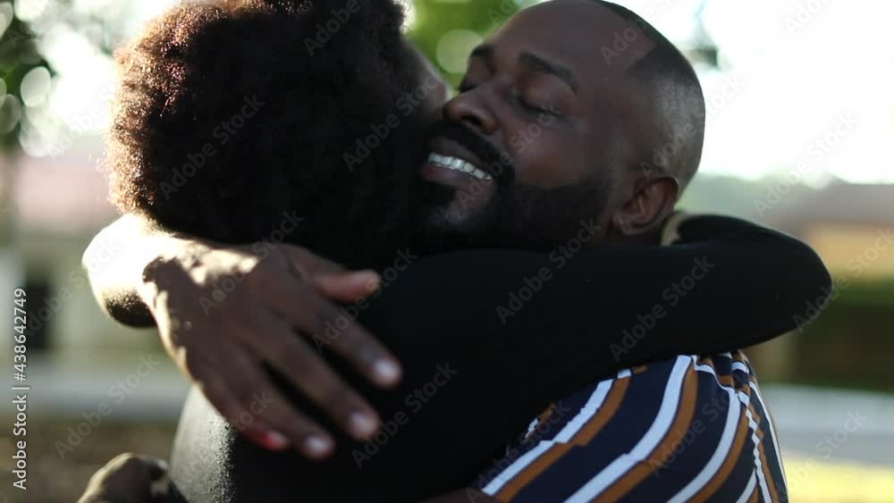 Couple embrace with lens-flare sunlight. Two people hugging each other ...