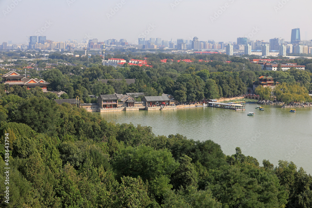 Beijing Summer Palace and modern urban landscape in the distance, China