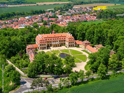 Aerial view of classicist chateau of French style. Large chateau, built by Salm noble family, surrounded by park, trees and hills. Summer, Rájec nad Svitavou, traveling Czech republic. photo