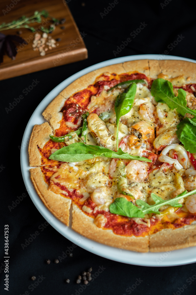 Seafood Pizza ,hand pick pizza, eating pizza and having fun. leisure, food and drinks, people and holidays concept