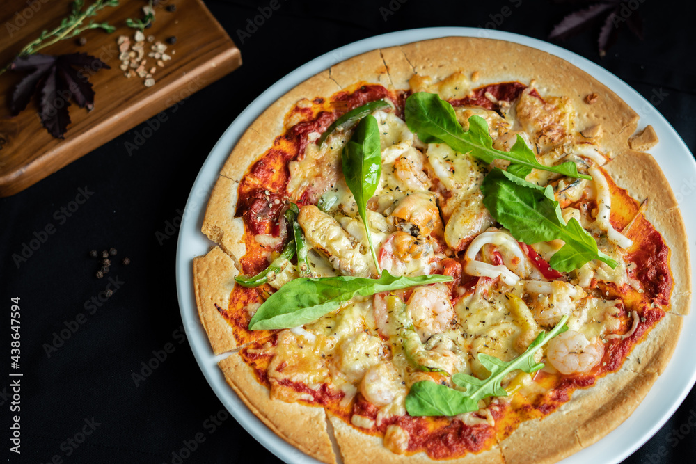 Seafood Pizza ,hand pick pizza, eating pizza and having fun. leisure, food and drinks, people and holidays concept Seafood Pizza ,hand pick pizza, eating pizza and having fun. leisure, food and drinks, people and holidays concept