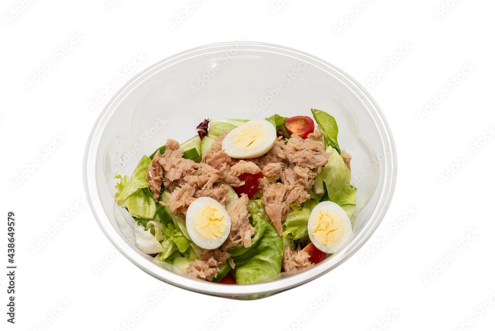 Fresh tuna salad with lettuce, cucombers, cherries and eggs in plastic container. Fresh tuna salad with lettuce, cucombers, cherries and eggs in plastic container.