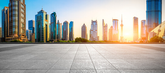 Sunset empty square road and city skyline in Shanghai