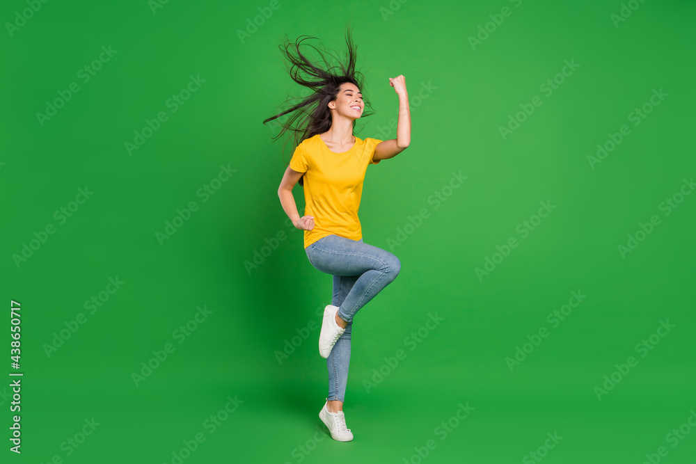 Full length body size photo dreamy girl brunette hair gesturing like winner isolated vivid green color background Full length body size photo dreamy girl brunette hair gesturing like winner isolated vivid green color background