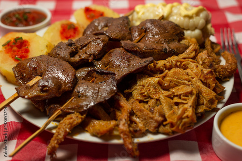 anticuchos de corazón con rachi, comida peruana Stock Photo | Adobe Stock