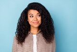 Photo of sweet curly hairdo millennial lady look empty space wear brown shirt isolated on vivid blue color background