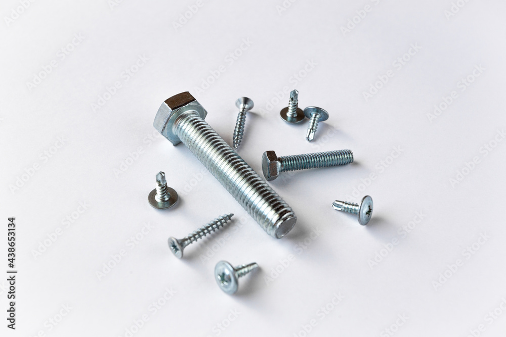 lots of silver bolts on a white background