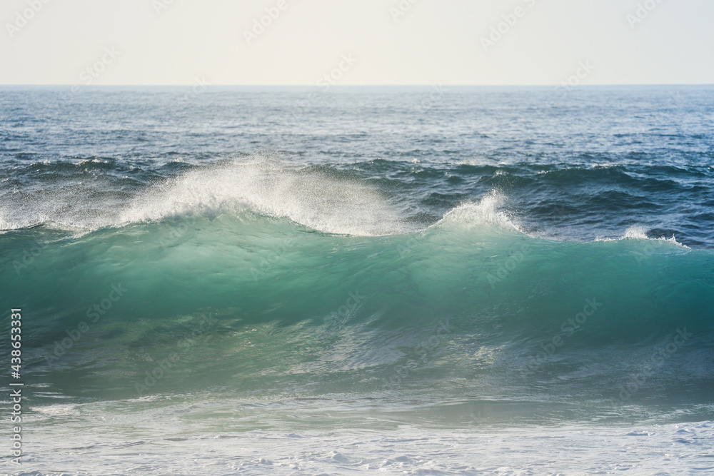 Perfect waves breaking in a beach	