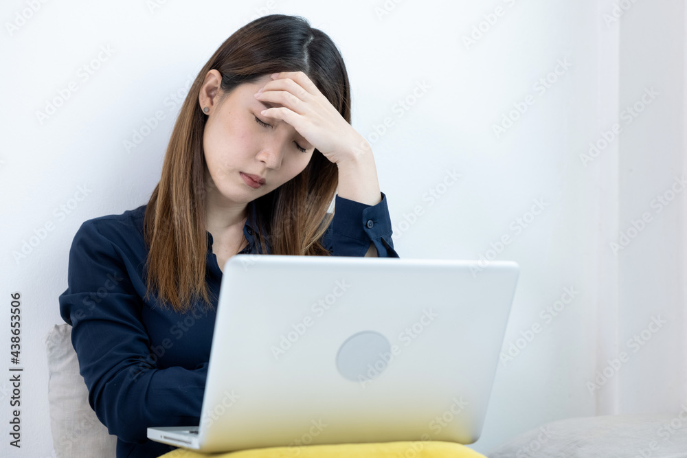 Asian woman are stressed out at work, Businesswoman working on laptop computer. Asian woman are stressed out at work, Businesswoman working on laptop computer.