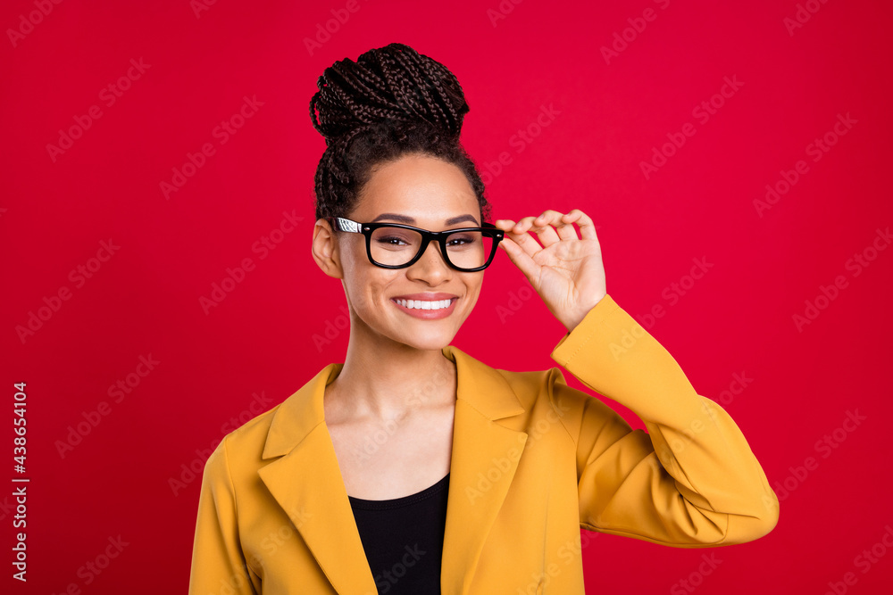 Photo of nice agent lady touch eyewear wear yellow cardigan isolated on vivid red color background