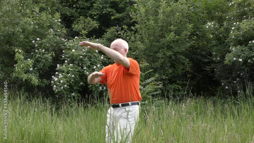 Old man athlete trains kicks workout exercises Old man athlete trains kicks workout exercises
