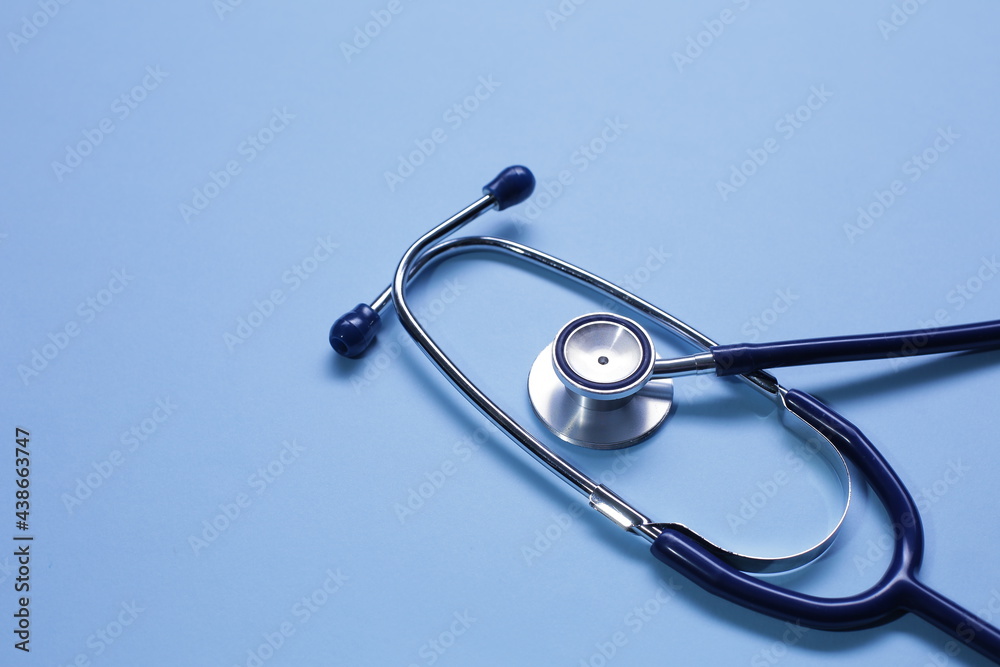 Blue medical stethoscope isolated on blue background Blue medical stethoscope isolated on blue background