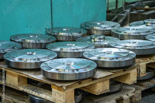 Steel round products in metal processing plant or factory close up, metalwork and steel processing in heavy industry. © DedMityay
