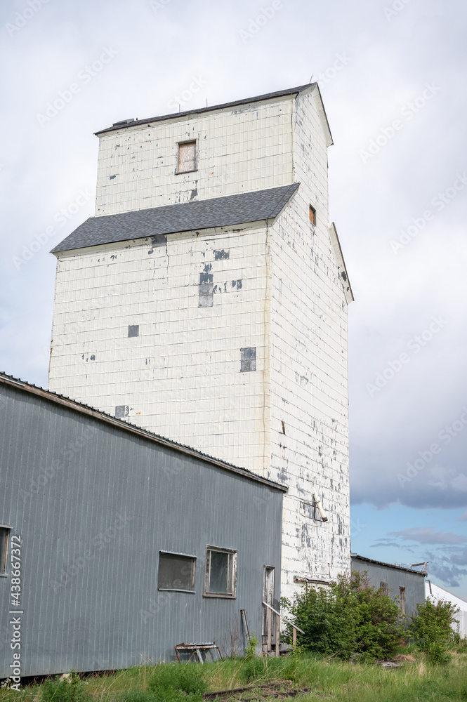 De Winton, Alberta - May 5, 2021: Old grain elevators outside the small town of De Winton, Alberta.