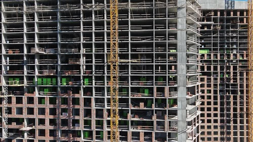 Aerial view of construction of tall residential buildings. Real estate in modern cities.