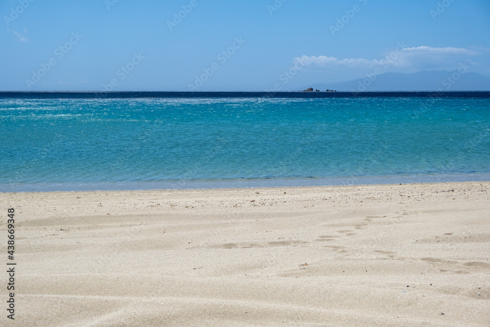 Sandy beach, ocean sea water, summer vacations concept
