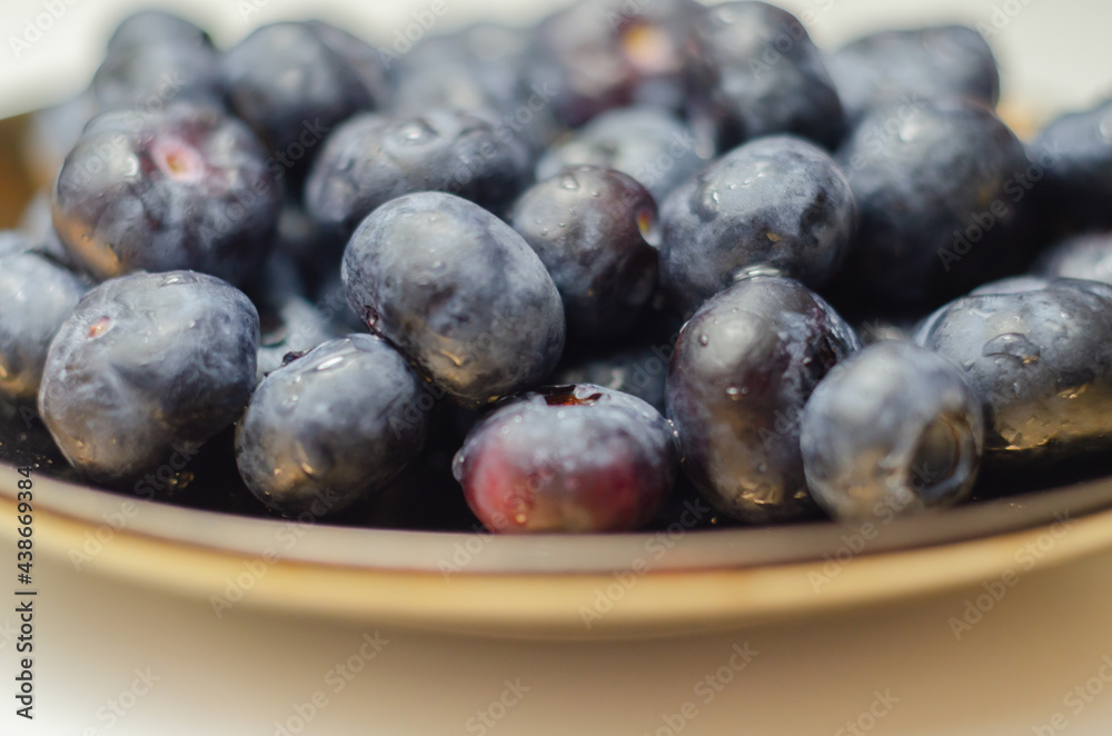 Closeup on fresh and ripe blueberries on a white background Closeup on fresh and ripe blueberries on a white background