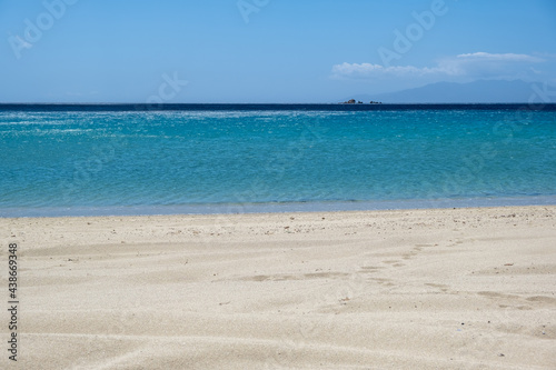 Sandy beach, ocean sea water, summer vacations concept © Rawf8