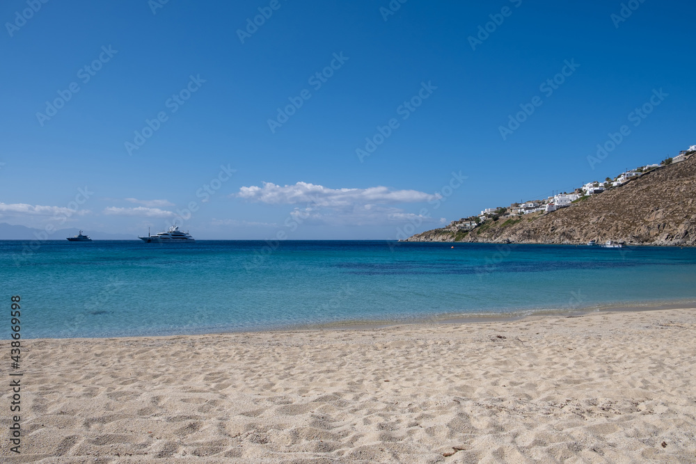 Obraz premium Mykonos island, Cyclades. Greece. Psarou sandy beach, summer holidays concept