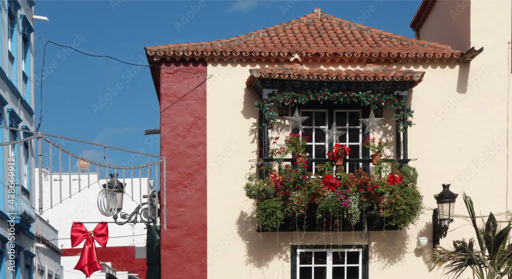 traditional, aristocratic balcony in Arabic style, decorated with many flowers. In the Canary Islands, La Palma