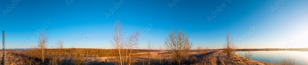 Early spring on a beautiful lake. Blue sky, cloudless and clear. Early spring on a beautiful lake. Blue sky, cloudless and clear.