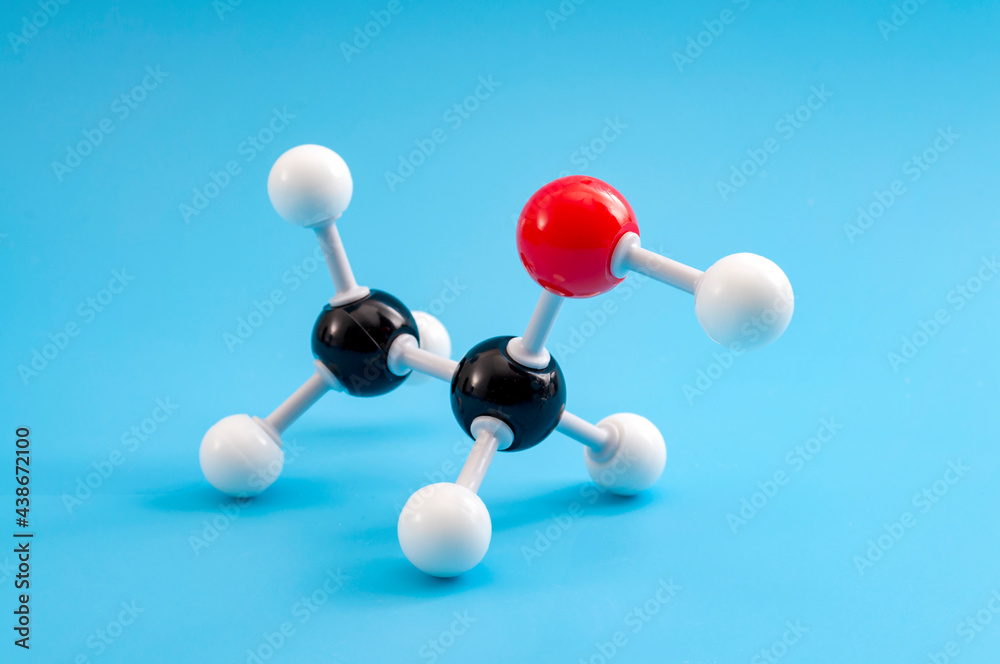 Molecular structure of chemical compounds and organic chemistry concept with educational plastic model of ethanol molecule isolated on blue background - obrazy, fototapety, plakaty 
